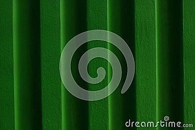 Green brick wall background.Grassy surface of colour building. Stock Photo