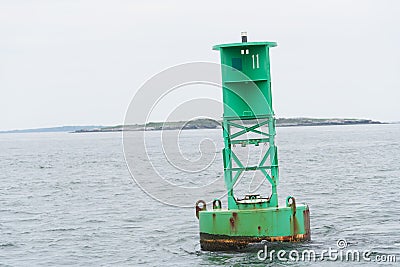 Green Buoy in a shipping lane Stock Photo