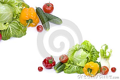 Green cabbage. Yellow pepper. Red tomatoes and cucumbers on a wh Stock Photo