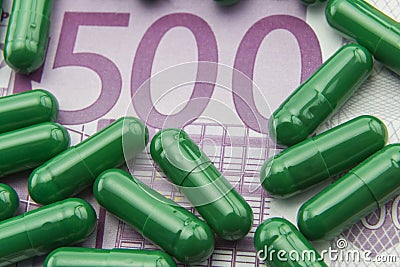 Green capsules up ticket of 500 euros Stock Photo