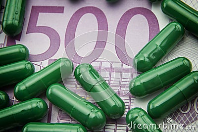 Green capsules up ticket of 500 euros Stock Photo