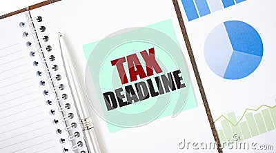 Green card on the white notepad. Text TAX DEADLINE. Business concept Stock Photo