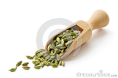 Green cardamom pods in wooden scoop Stock Photo