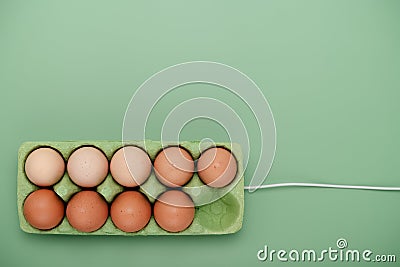 Green carton of eggs with cable. Loading Easter background Stock Photo