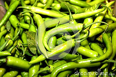 Green chilis scattered at display Stock Photo