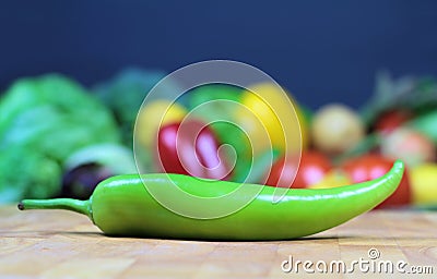 Green chily on a chopping board Stock Photo