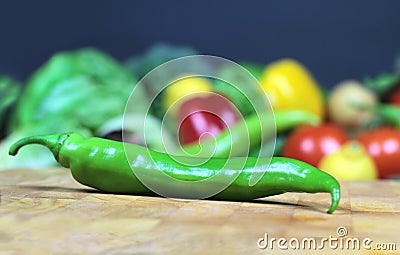 Green chily on a chopping board Stock Photo