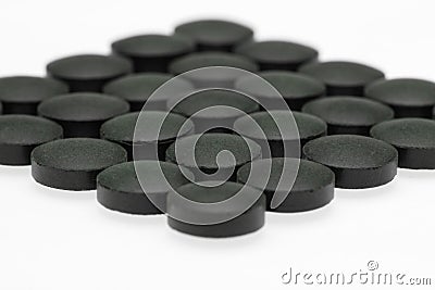 Green chlorella tablets Stock Photo