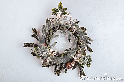 Green christmas wreath with decorations on white background Stock Photo
