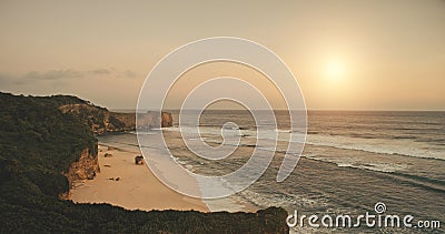 Green cliff shore at sun light aerial. Sand beach washed by ocean bay waves. Nobody nature seascape Stock Photo