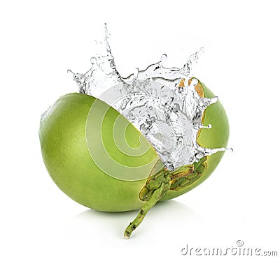 Green coconut with water splash isolated on white background. Stock Photo