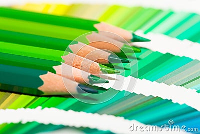Green colored pencils and color chart Stock Photo
