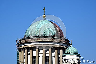 Green copper plated cupola roofing in process of replacement with shiny new red copper. renovation concept Stock Photo