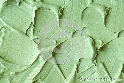 Green cosmetic clay cucumber facial mask, avocado face cream, green tea matcha body wrap texture close up, selective focus. Stock Photo