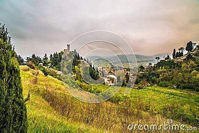 The green countryside around the clock tower Stock Photo