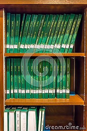 Green cover thesis on the bookselfs on Chulalongkorn university Editorial Stock Photo