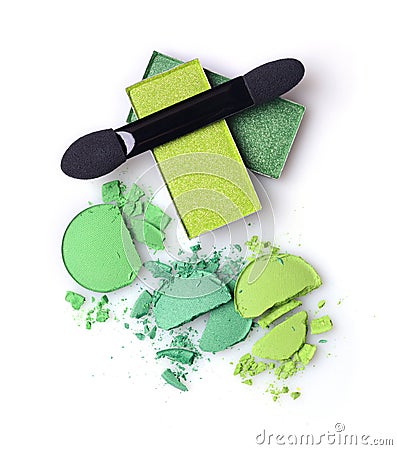 Green crashed eyeshadow for makeup as sample of cosmetics product with applicator Stock Photo