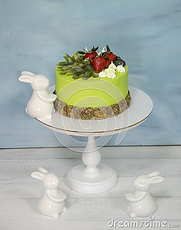 A green creamchease cake with berries and marmalade Stock Photo