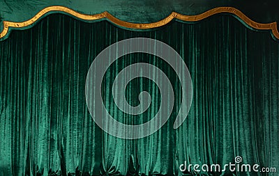 Green curtain of luxurious velvet on the theater stage. Copy space. The concept of music and theatrical art. Stock Photo