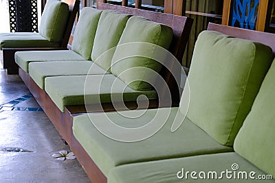 Green cushion on wooden sofa chair. living design for home Stock Photo