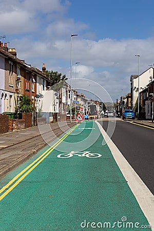 A green cycle lane in a city on a main road Editorial Stock Photo