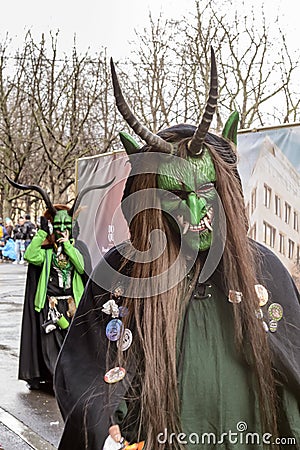 Green devils at Carnival parade, Stuttgart Editorial Stock Photo