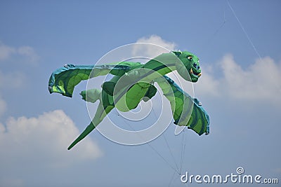 Green dragon shape kite. Editorial Stock Photo