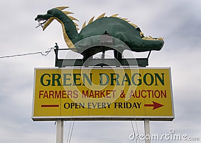 The Green Dragon sign at the entrance Editorial Stock Photo