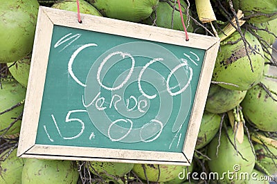 Green Drinking Coconuts for Sale Sign in Brazil Stock Photo