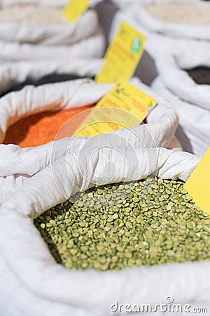 Green dry peas detail in white bag Stock Photo