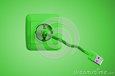 Green electric socket on the wall and usb cord Stock Photo