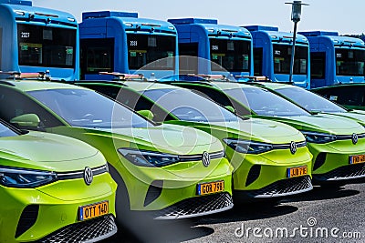 Green electric Volkswagen cars parked in a row.. Editorial Stock Photo