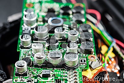 Green electronic board with many capacitors and resistors close-up. Electronic camera chip Stock Photo