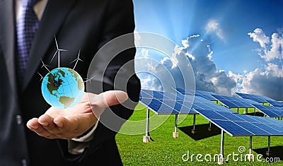 Green energy concept, Businessman carry world of wind turbine Stock Photo