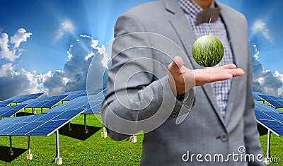 Green energy concept, Businessman carry world of wind turbine Stock Photo