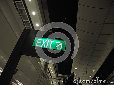 Green exit direction signage with up right arrow Stock Photo