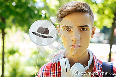 Green-eyed progressive student using technique of thinking hats Stock Photo