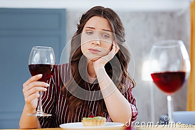 Green-eyed woman being left alone on Friday night Stock Photo