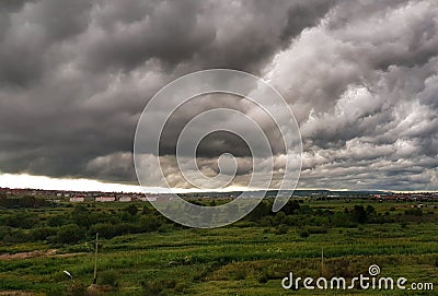 Green field amond amazing cloudy rainy sky Stock Photo