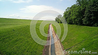 Green field and water road Stock Photo