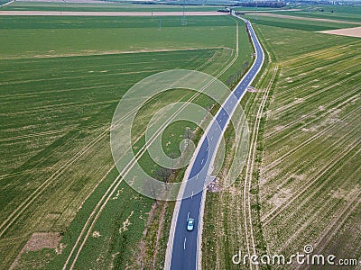 Green fields crossed by the highway Stock Photo