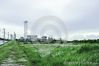 Green fields with modern factory buidling for green industry concept Stock Photo