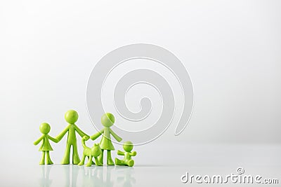 Green figures made of biodegradable plastic model of family with children Stock Photo