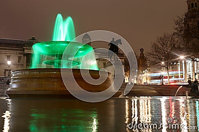 Green fountain for earth day with slow shutter speed at Trafalgar Square Editorial Stock Photo