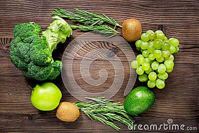 Green fresh food for fitness diet on wooden table background top view mock up Stock Photo