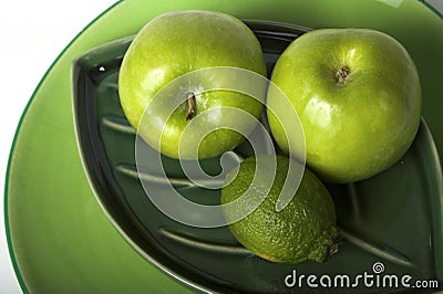 Green fruits on plates Stock Photo