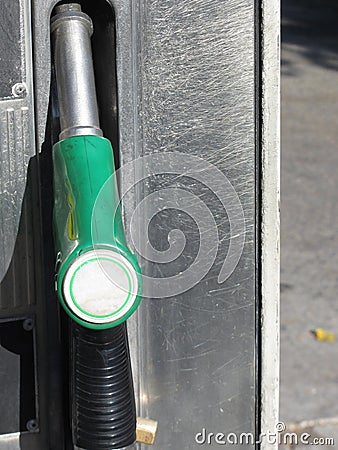 Green fuel pistol on gas station . Unleaded petrol at the pump station Stock Photo