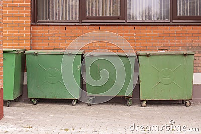 Green garbage waste collection dumpster, problems of ecology sorting waste trash, separate collection of garbage Stock Photo