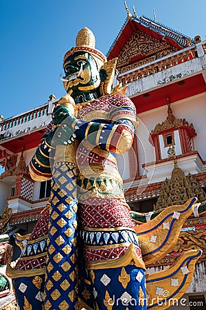 Green giant statue guarding Thai temple Stock Photo