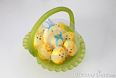 glass easter basket, with chick eggs, and fuzzy chicken disguised as bunny Stock Photo